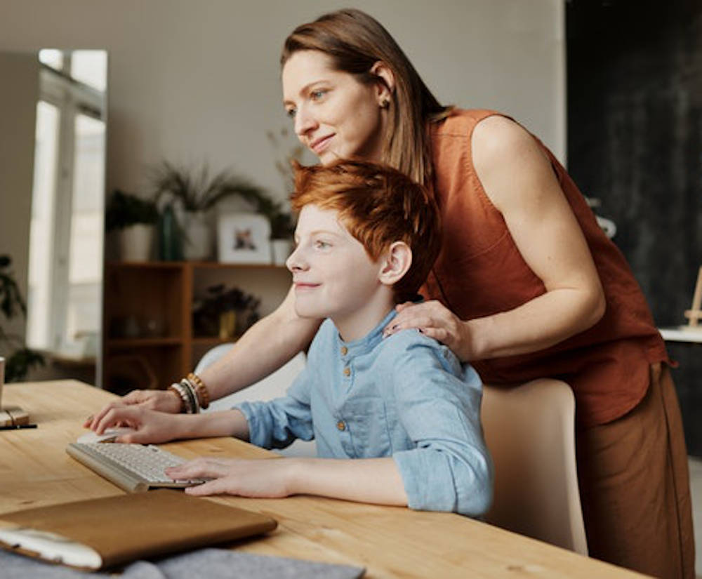 A mother and son doing a video class