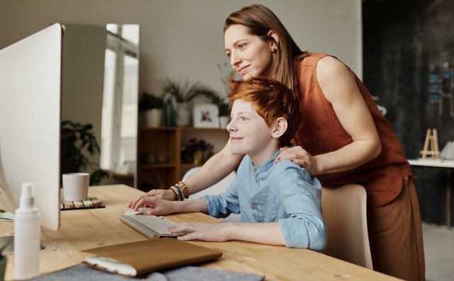 A mother and son doing a video class